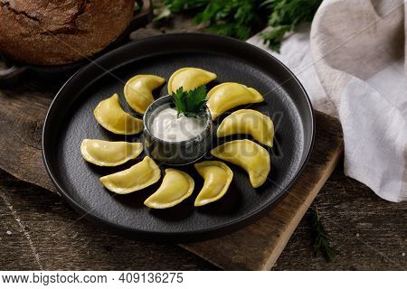 Appetizing Traditional Russian Dumplings Made By Hand With Delicious Filling. Still Life On A Wooden
