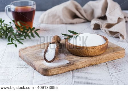 Natural Sweetener In A Wooden Spoon. Sugar Substitute. Erythritol