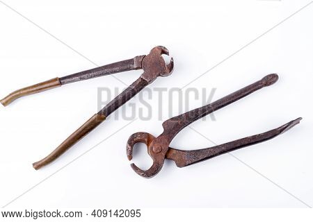 Old Pliers. Pastizzi On A White Plate Close-up.