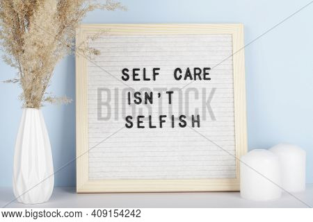 Dried Pampas Grass In Vases, Candles And Felt Letter Board With Phrase Self Care Is Not Selfish On B