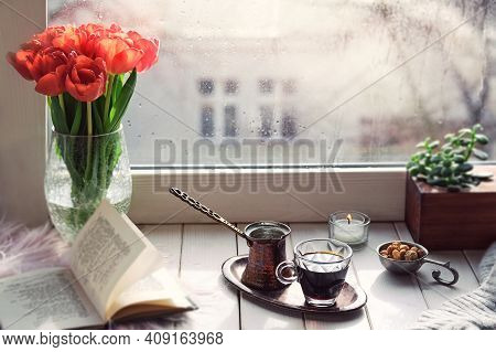 Oriental Coffee Cooked In Traditional Turkish Copper Coffee Pot With Flowers On Windowsill. Ruscic W