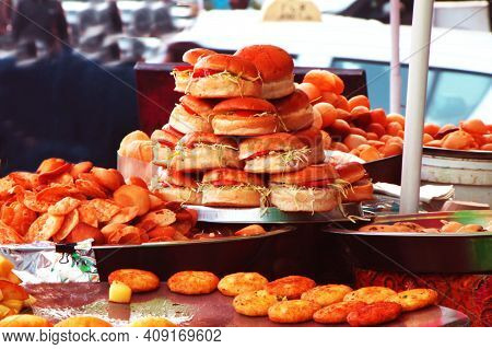 Elicious Burger With Sauce. Hamburger. Delicious Grilled Angus Burger With Cheese, Salad And Tomatoe