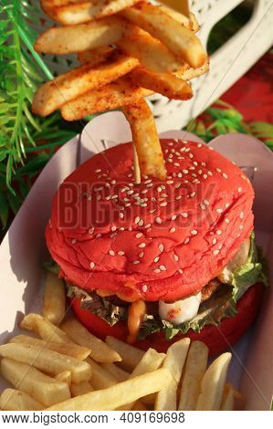 Elicious Burger With Sauce. Hamburger. Delicious Grilled Angus Burger With Cheese, Salad And Tomatoe