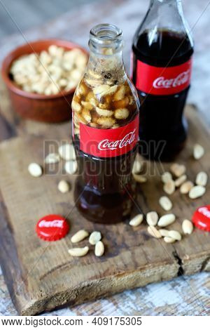 Coca Cola Bottles With Peanuts. Traditional American Snack.