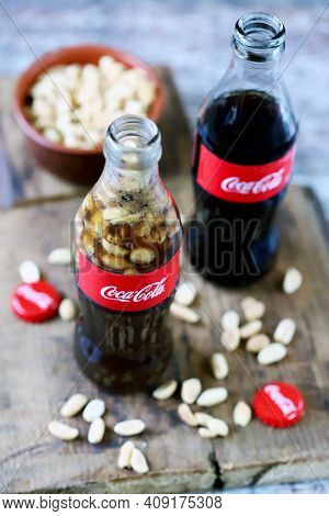 Coca Cola Bottles With Peanuts. Traditional American Snack.