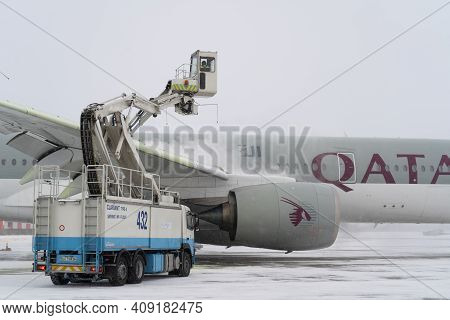 Ukraine, Kyiv - February 12, 2021: De-icing The Aircraft Before The Flight. The Deicing Machine Spri