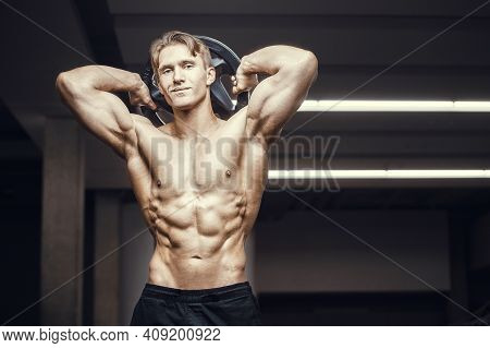 Fitness Man At Workout In Gym With Bodybar Stretching Muscles. Workout Fitness And Bodybuilding Heal