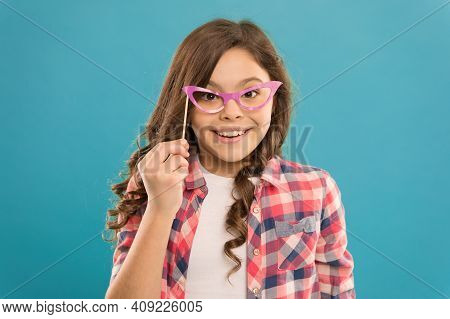 Child In Good And Positive Mood. Looking Strict In Glasses. Small Girl Prefect Casual Fashion. Happy