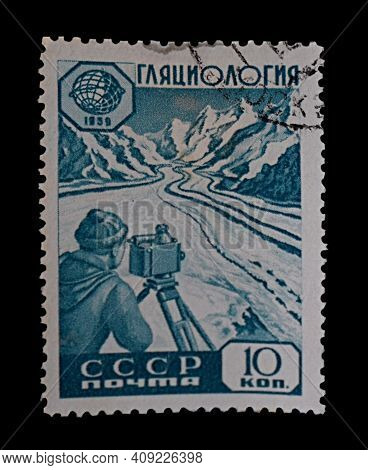 Bakhmut, Ukraine, February, 2021. Postage Stamp Of The Ussr, 1959. The Glaciologist Makes Geodetic M