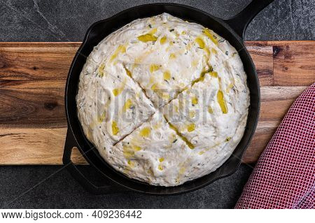Dough For A Rosemary Parmesan Skillet Bread Being Placed In A Cast Iron Skillet,  With Oilive Oil, G