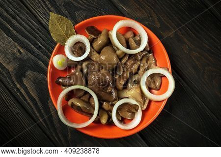 Suillus Luteus Or Boletus Luteus Mushrooms Marinated In A Plate With Spices And Bay Leaves On Vintag