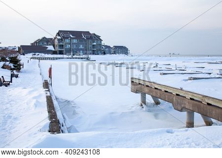 The Frozen In Slips At The Private Marina At Lighthouse Point, In Collingwood, Sits Empty All Winter