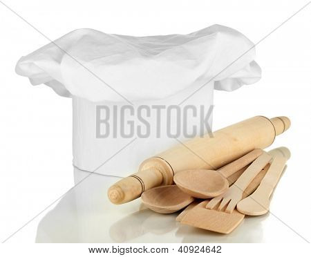 Kochmütze mit Löffel und Federballschläger, isolated on white
