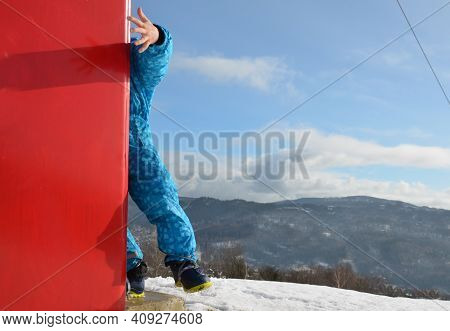The Child Hits The Foam Barrier At High Speed On A Pole Near The Ski Slope. Safety Protection Of An 