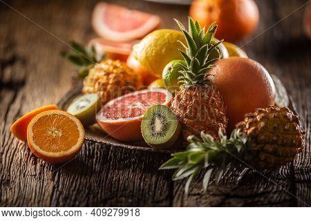 Assortment Of Fresh Exotic Fruit Ideal For Detox On A Rustic Wood Surface.