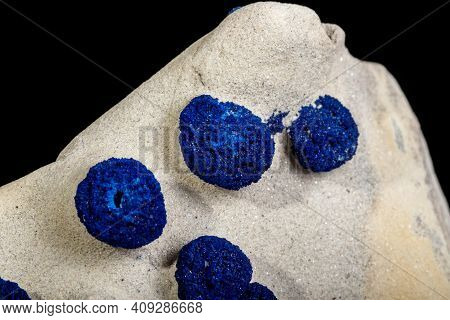 Macro Mineral Stone Azurite In Siltstone Against Black Background