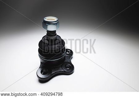 New Spare Parts Axel Car Elements. Off-road Ball Joint Car Suspension On A Gray Background.