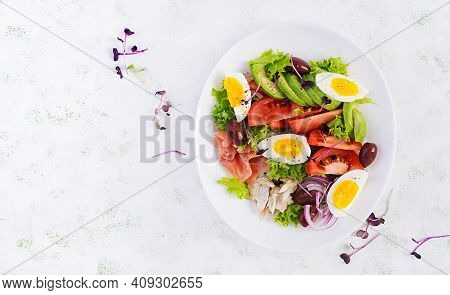 Ketogenic Diet Breakfast. Salt Salmon And Baked Dorado Salad With Greens, Tomatoes, Eggs And Avocado