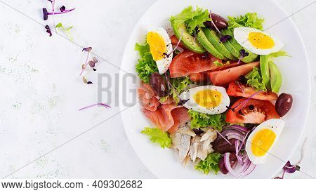 Ketogenic Diet Breakfast. Salt Salmon And Baked Dorado Salad With Greens, Tomatoes, Eggs And Avocado