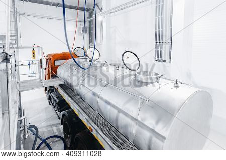 Milk Tanker Truck Pumps Products Into Steel Storage Tanks, Dairy Factory Industry