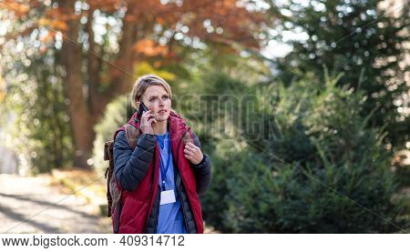 Woman Caregiver, Nurse Or Healthcare Worker Outdoors On The Way To Work, Coronavirus Concept.