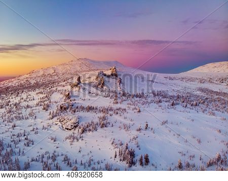 Colorful Winter Sunset In Sheregesh Ski Resort Mountains With Clouds. Aerial Top View Forest Russia