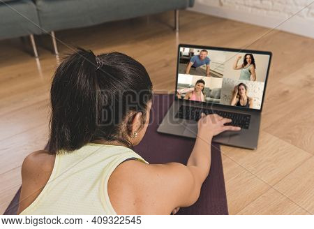 People Exercising At Home Connected To Online Fitness Class On Laptop. Woman Personal Trainer Coach 
