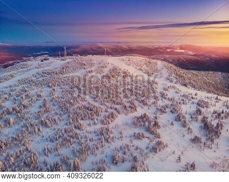 Colorful Winter Sunset In Sheregesh Ski Resort Mountains Covered Trees. Aerial Top View Beautiful Fo