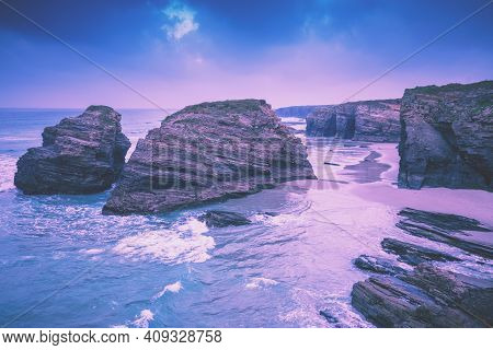 Rocky Sea Coast At Sunrise. Beach Playa De Las Catedrales. Praia De Augas Santas. Ribadeo, Spain
