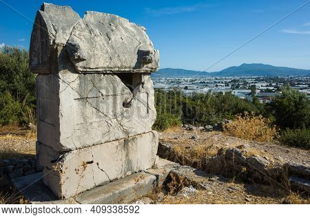 Rock tomb ruin at necropolis of Xanthos Ancient Lycia City, Turkey. Old Lycian civilization heritage architecture