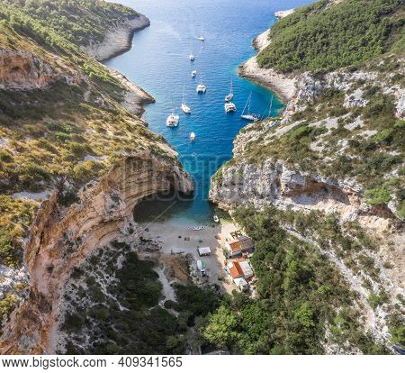 Aerial Drone Shot Of Iconic Stiniva Cove Beach Of Adriatic Sea On Vis Island In Croatia Summer