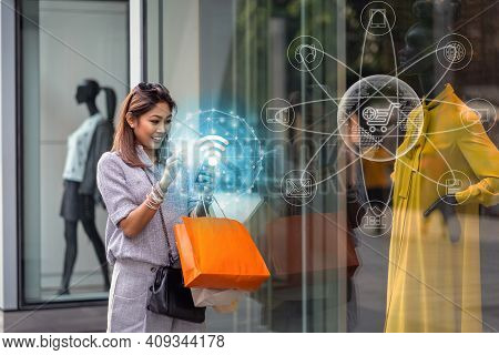 Asian Woman Using The Smart Mobile Phone For Check Online Shopping Order Is Completed Via Omni Chann