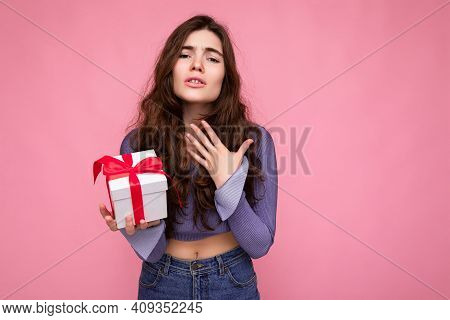 Shot Of Beautiful Upset Concerned Brunette Curly Young Woman Isolated Over Pink Background Wall Wear