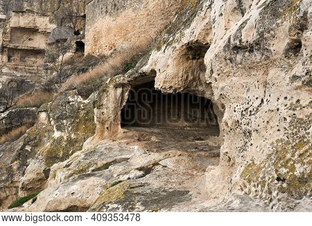 View Of The Ruins Of A Medieval Cave City-fortress On A Rocky Slope
