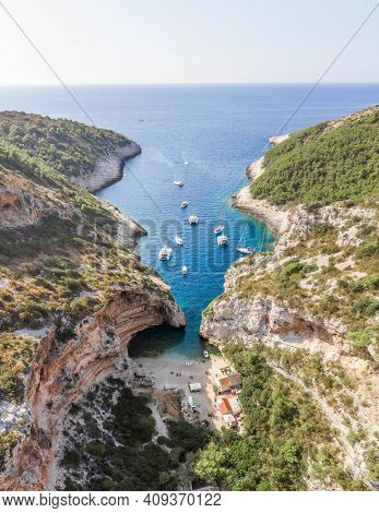 Aerial Drone Shot Of Iconic Stiniva Cove Beach Of Adriatic Sea On Vis Island In Croatia Summer