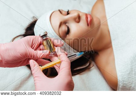 In The Hands Of A Syringe And A Container With The Drug, Cosmetology Lipolytic