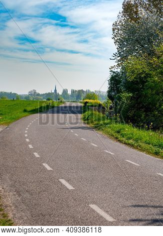 Spring Nature Landscape With Dam Road Along Waal River In Betuwe, Gelderland, Netherlands