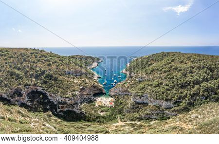 Aerial Drone Shot Of Tourists Relax At Stiniva Cove Beach Adriatic On Vis Island In Croatia Summer