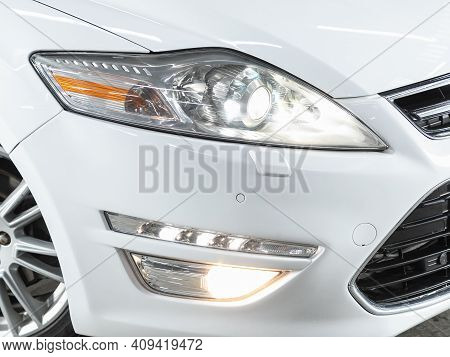 Novosibirsk, Russia - February 18 2021: Ford Mondeo, Headlight Of A Modern Popular Car Close-up. Shi