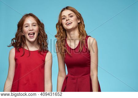 Cheerful Mom And Daughter Hugs Joy Lifestyle Communication Friendship Blue Background