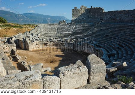 Ruins of Theatre in Xanthos Ancient Lycia City, Turkey. Sunny day, Old Lycian civilization heritage architecture amphitheater