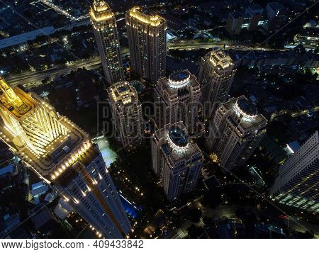 Pakubuwono Skyline Aerial Drone View From Above At Night, Jakarta Downtown Skyscrapers Cityscape And