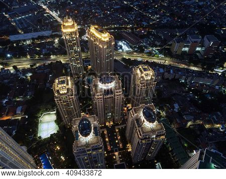 Pakubuwono Skyline Aerial Drone View From Above At Night, Jakarta Downtown Skyscrapers Cityscape And