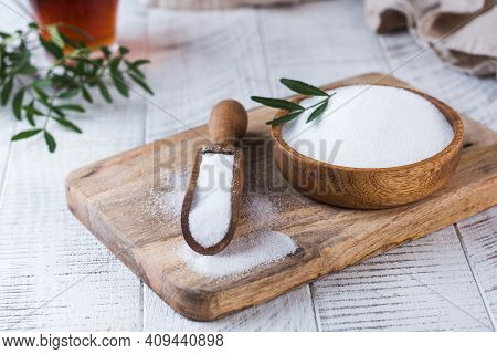 Natural Sweetener In A Wooden Spoon. Sugar Substitute. Erythritol