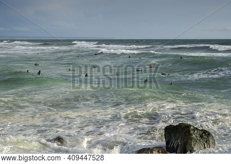 Costa Da Caparica, Portugal - April 17, 2019: Surfing In The Costa Da Caparica Beach, A Famous Place