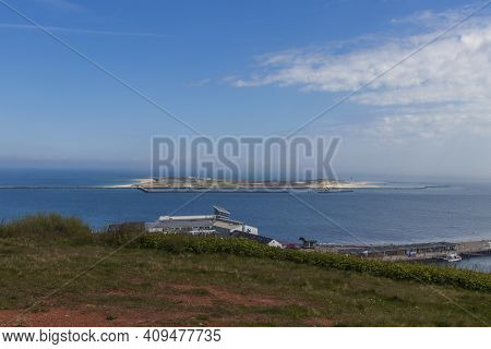 Houses And Alleys On The Island Of Helgoland With A View Of The Landscape And The Background Of The 