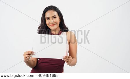 Asian Beautiful Young Woman Holding Empty Blank Paper. A Studio Portrait With White Background .empt