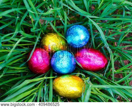 Colored Eggs For Easter Laid In The Grass