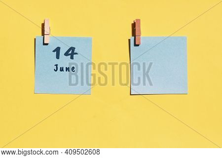 June 14st . Day Of 14 Month, Calendar Date. Two Blue Sheets For Writing On A Yellow Background. Top 