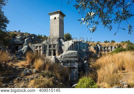 Rock tombs ruins at necropolis of Xanthos Ancient Lycia City, Turkey. Old Lycian civilization heritage architecture